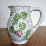 Barbotine pitcher with pastel flower decoration