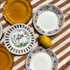 Set of twelve mismatched vintage dessert plates.