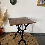 Bistro table with iron legs and raw wood top