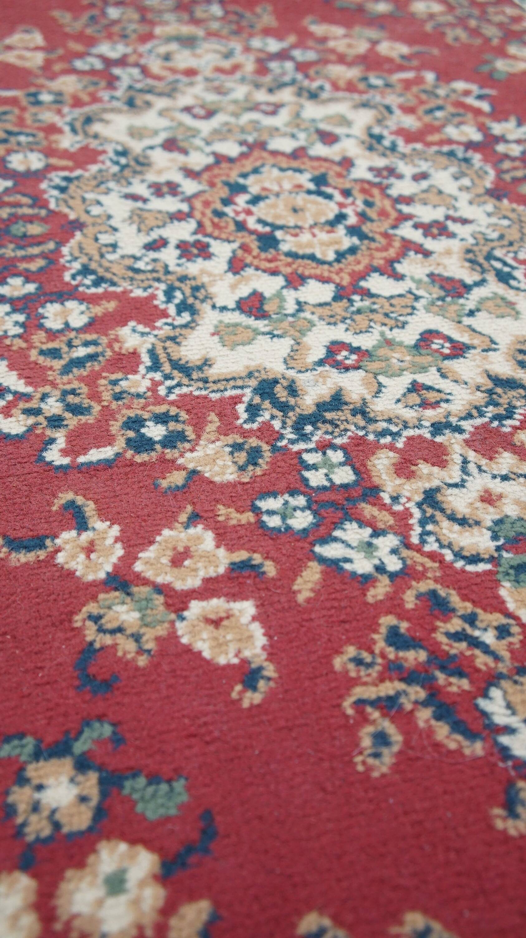 Vintage oriental rug with predominantly red, cream, and beige colors, measuring 168x120 cm