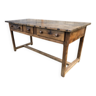 Antique chestnut table with 3 drawers on the front and with a cat bar.