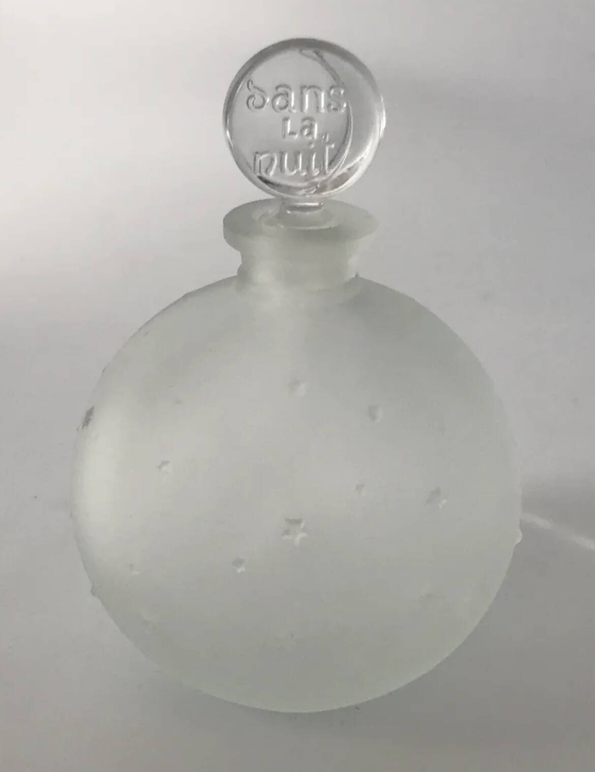 Lalique bottle in the night, frosted glass, ball shape