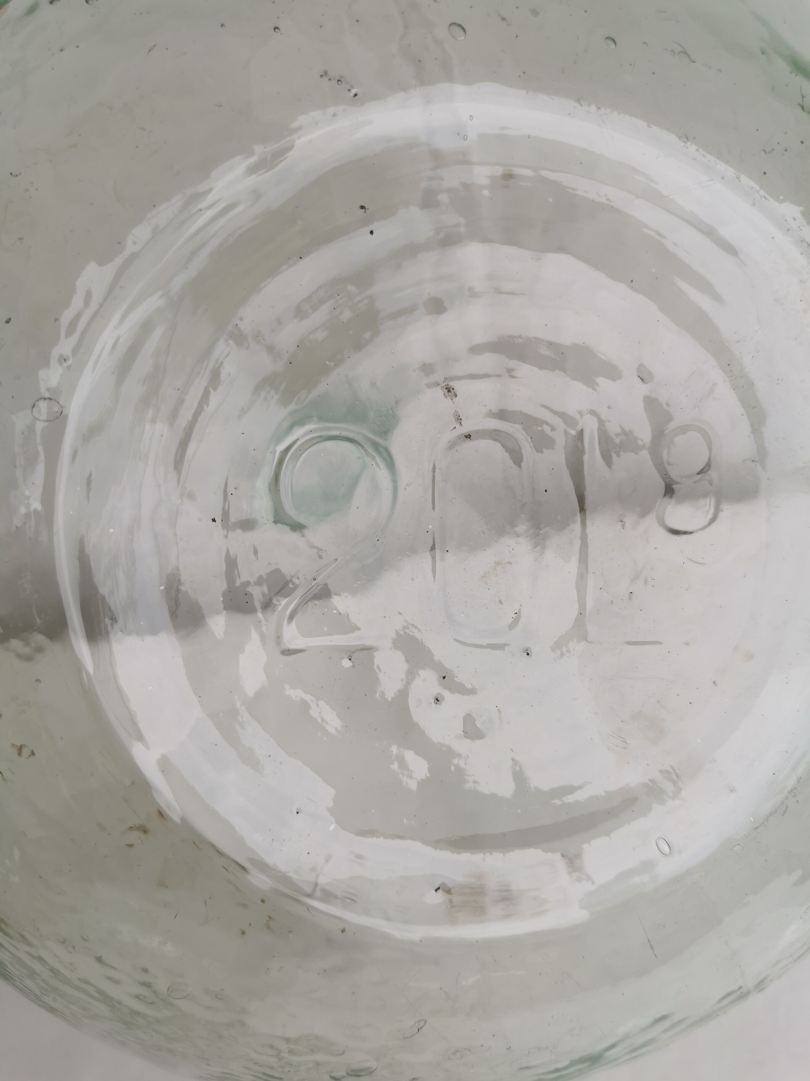 Large old lady Jeanne in transparent glass