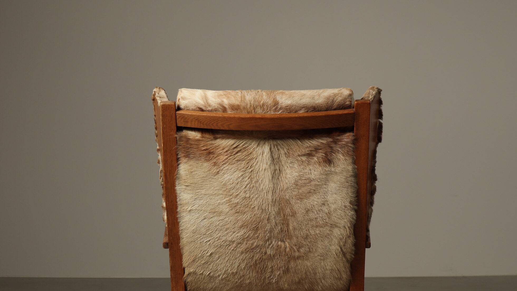 Brutalist oak lounge chair and ottoman in original goat hide, 1960s