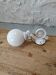 Wall light in cast iron and glass