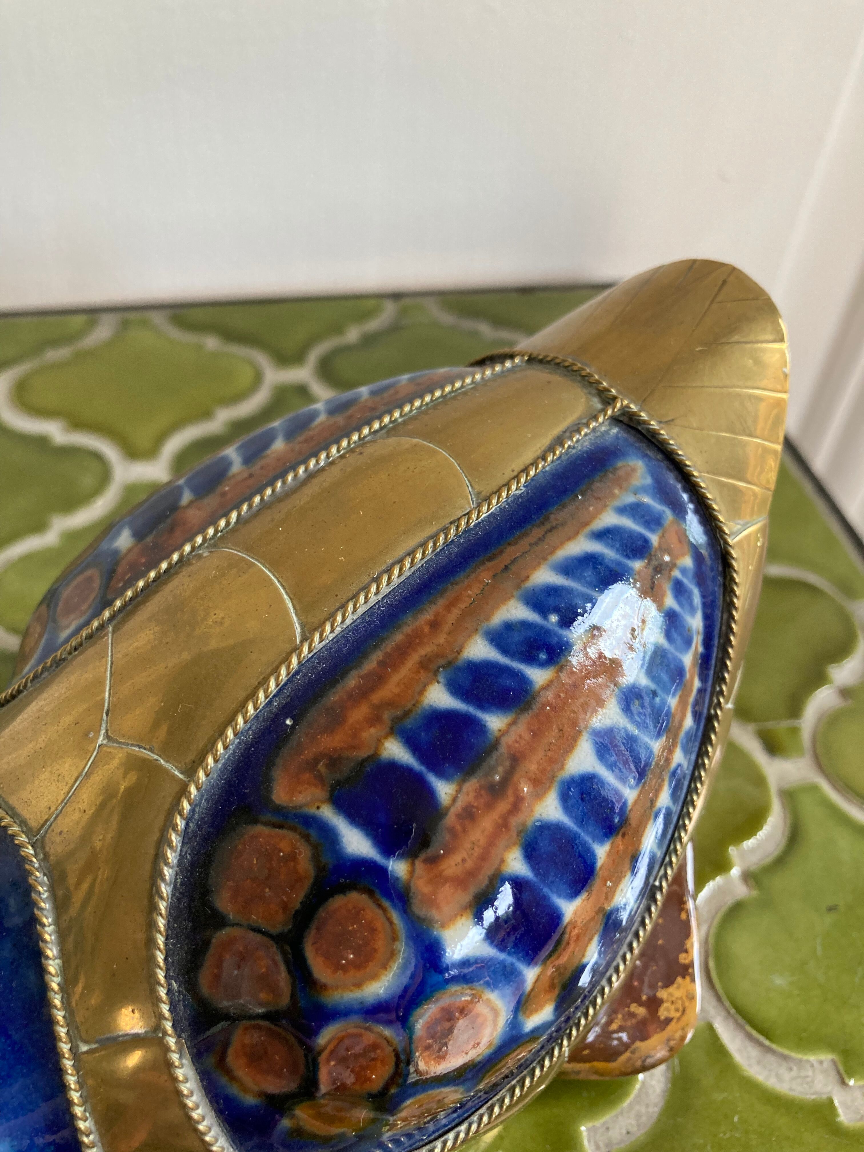 Brass duck and ceramic