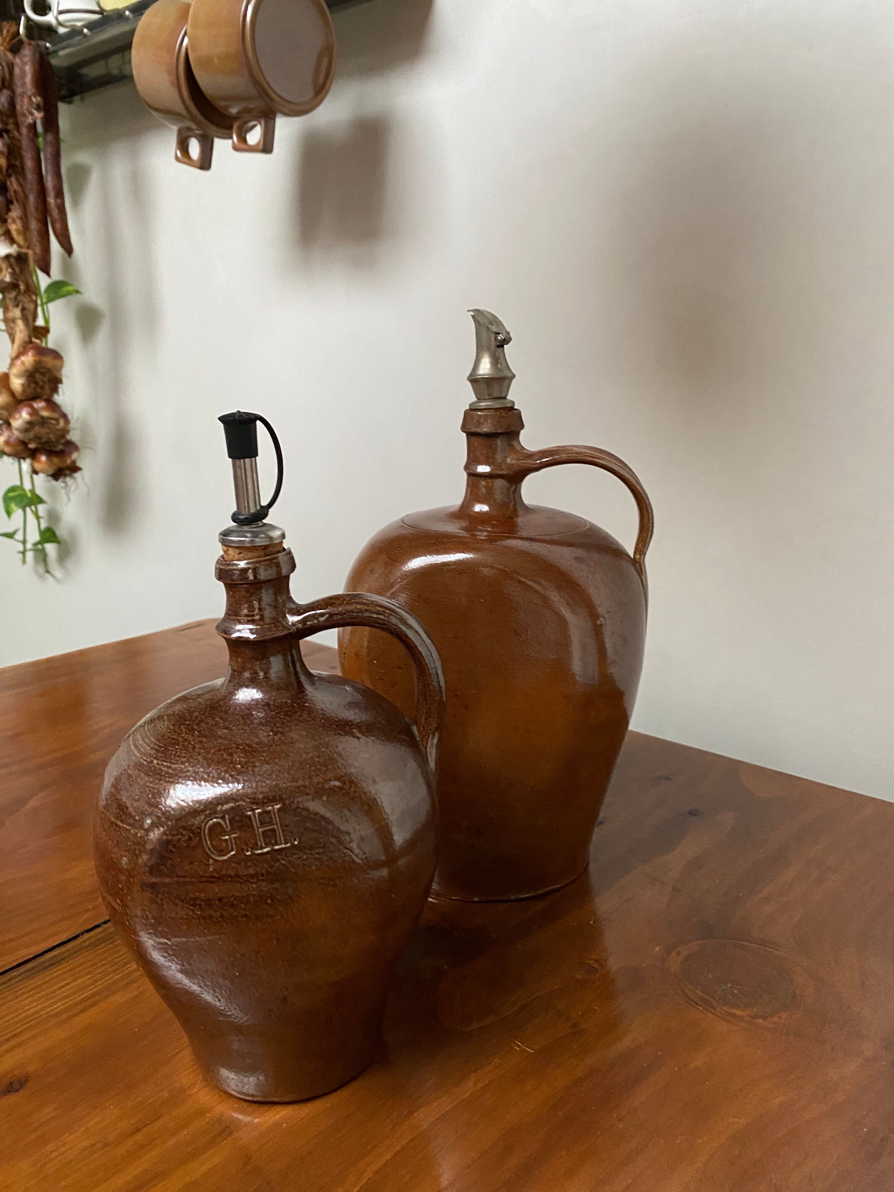 Pair of bottles in sandstone
