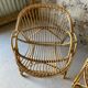 Vintage wicker armchair from the 1970s.