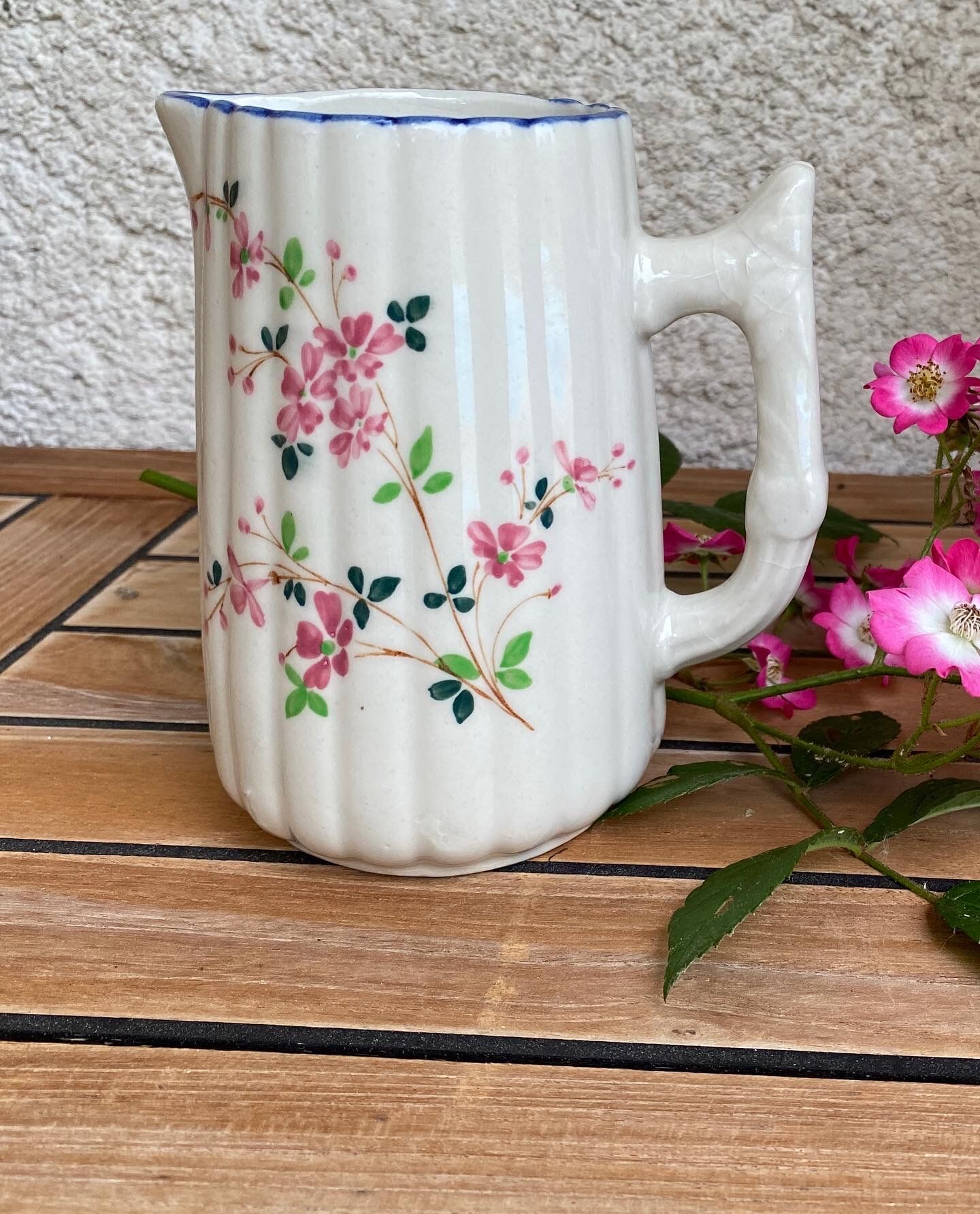 Small pitcher in iron earth with double old decoration