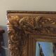 Miroir en bois doré 125 x 95 cm