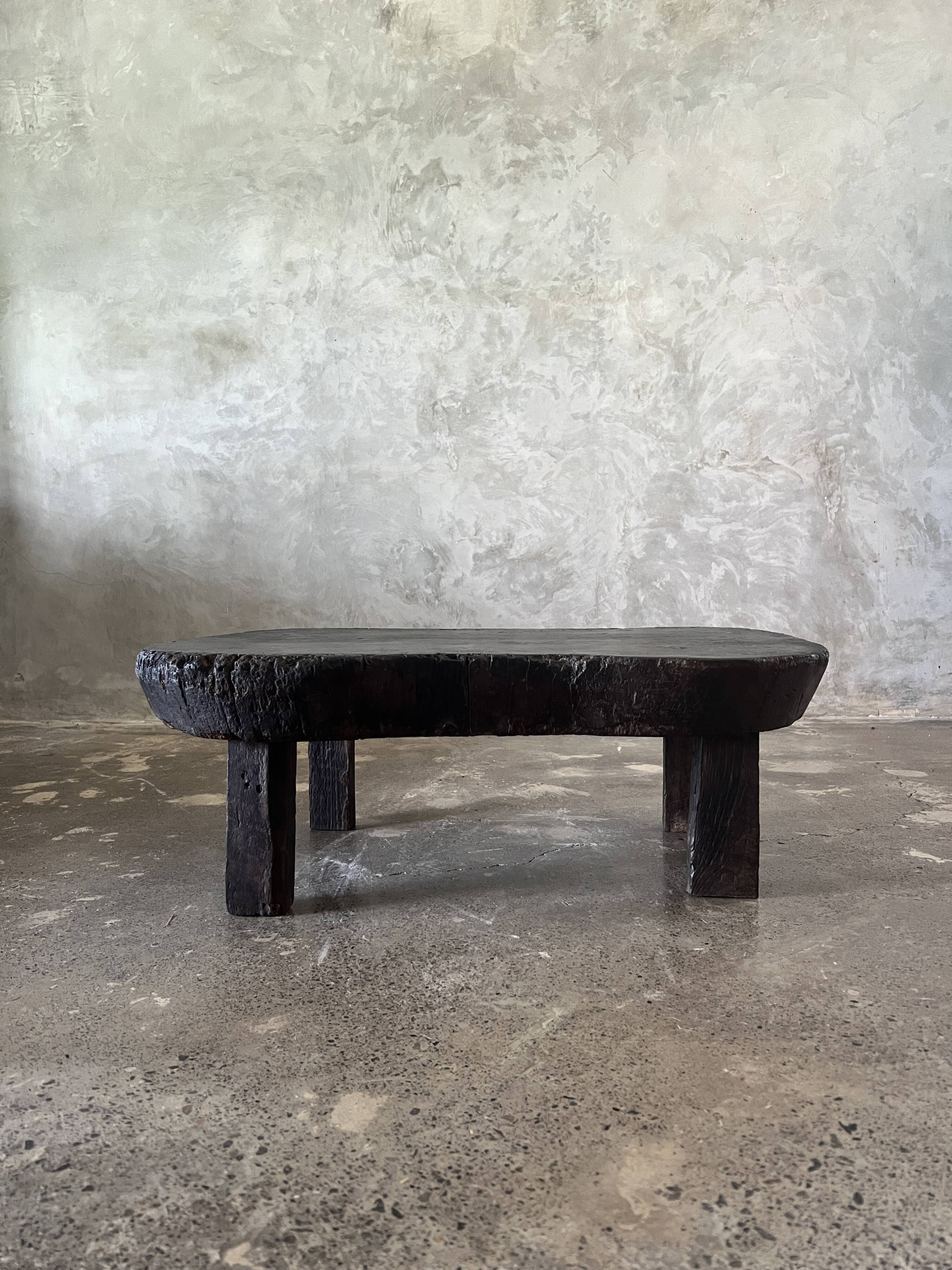 Small old Asian wooden coffee table in Japanese style, kidney-shaped top