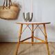 Round soft pink rattan table