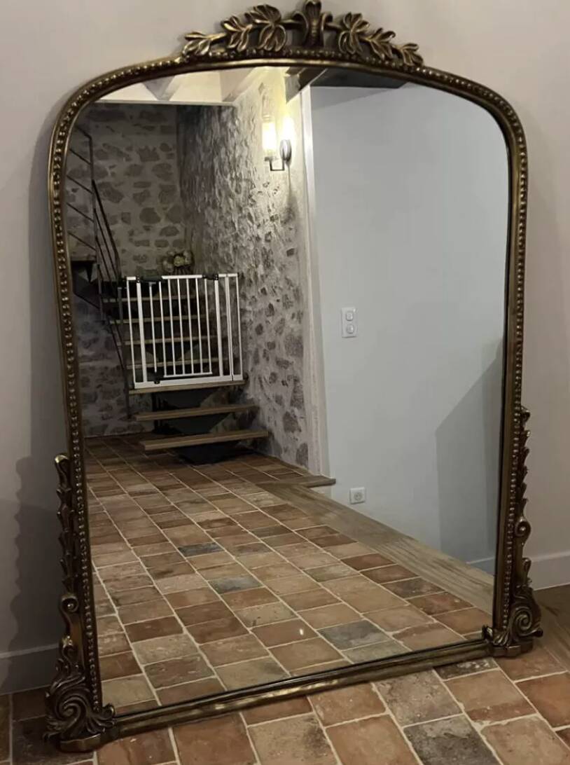 Large gilded mirror with pediment