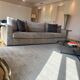 3-seater PMP Classy sofa in grey fabric and its 4 PMP cushions.