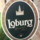 Double-sided "Loburg Beer" metal sign on wrought iron bracket