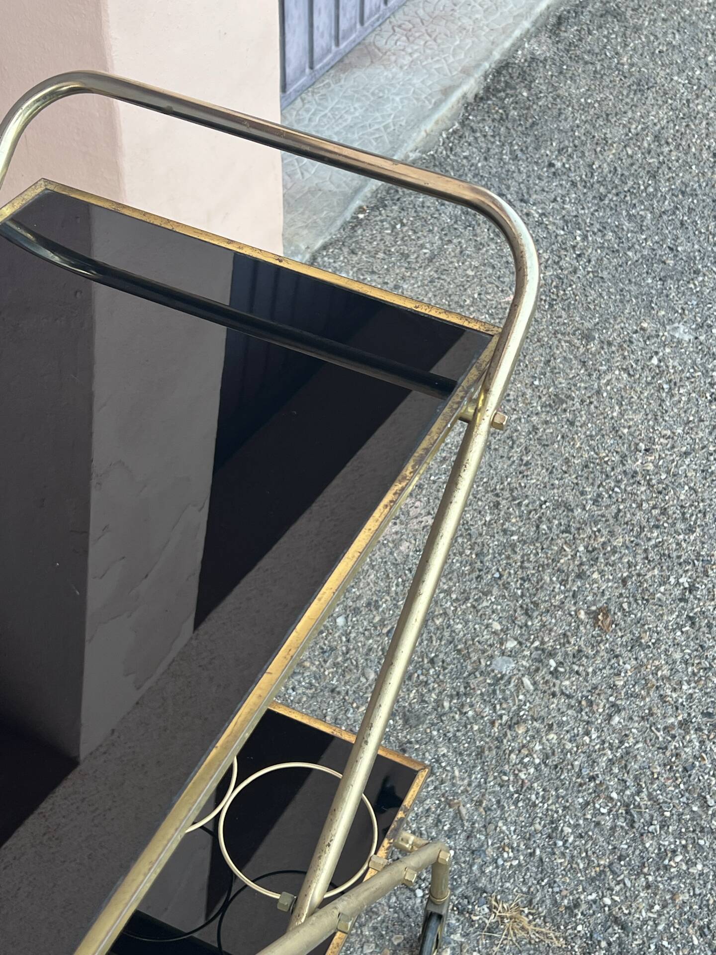 Vintage gold dessert bar with two black trays.