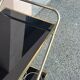 Vintage gold dessert bar with two black trays.