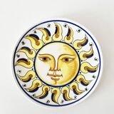 Decorative ceramic plate with sun face