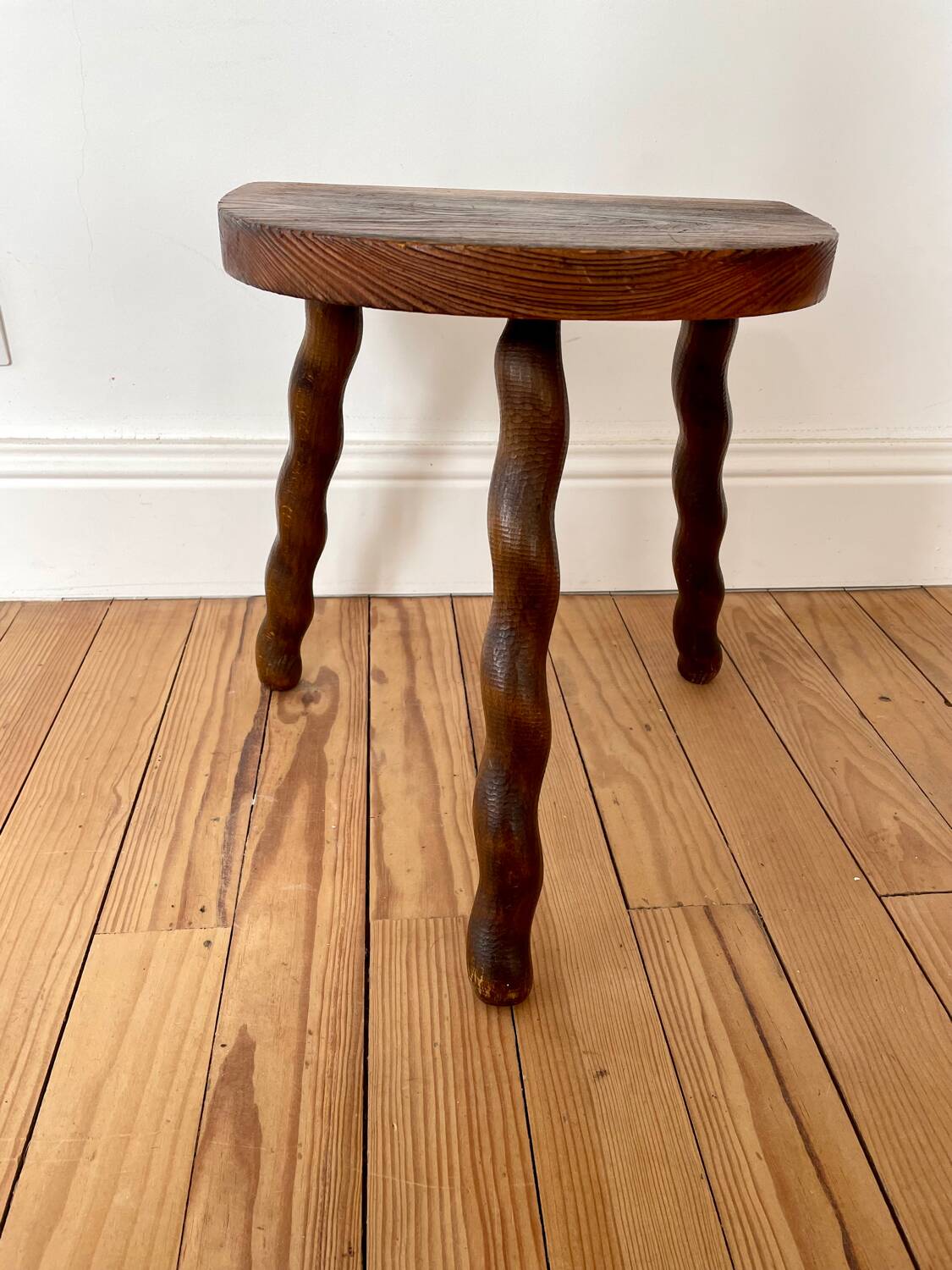 Vintage wooden half-moon tripod stool with twisted legs