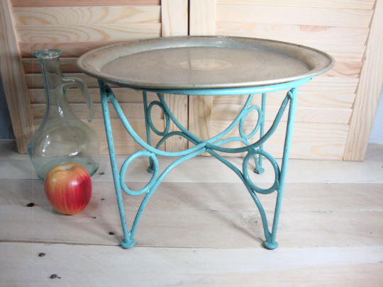 Small metal coffee table or plant stand.