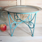 Small metal coffee table or plant stand.
