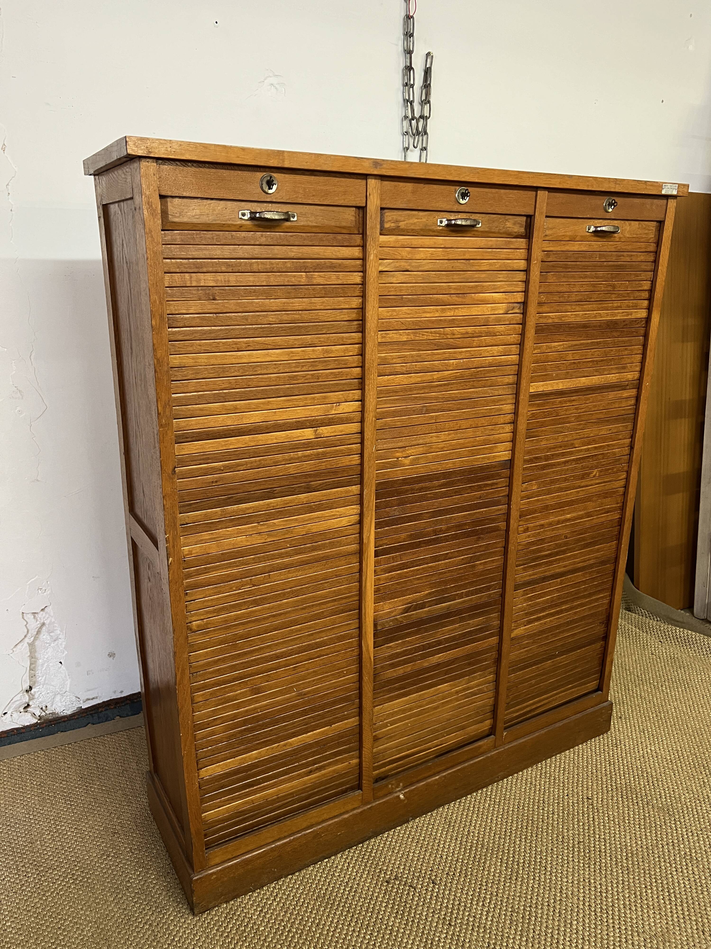 Old filing cabinet with triple curtains