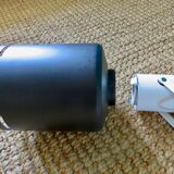 Pair of long white arm wall lights with black spot. "lita device"