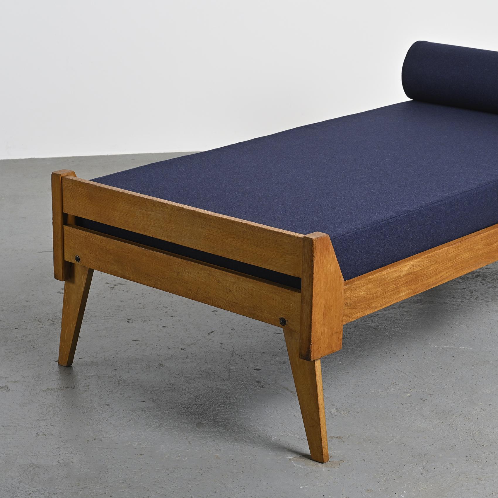 Wooden bench with midnight blue fabric, France, circa 1955
