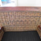 2 colonial-style armchairs in woven rattan and exotic wood