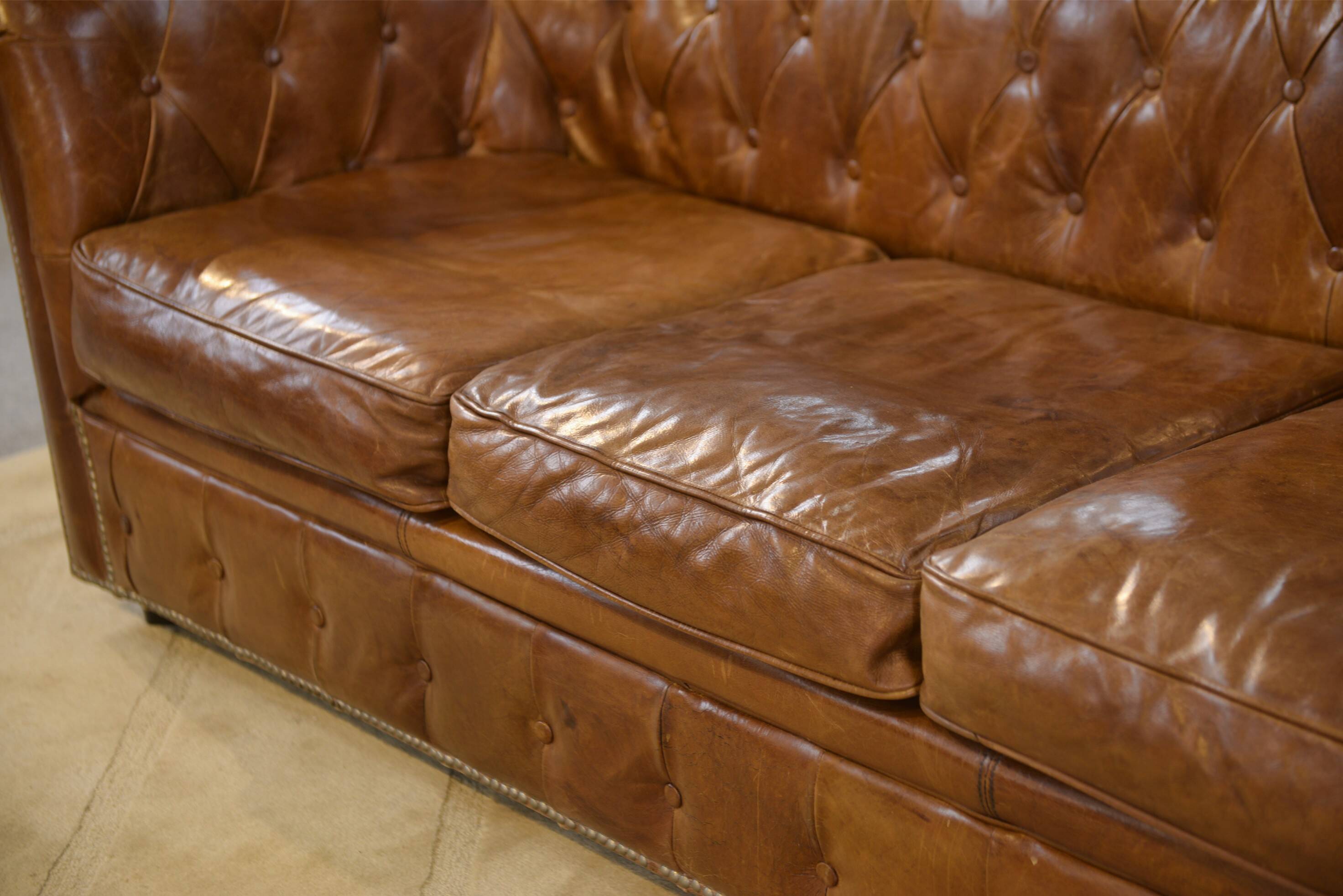 Brown leather Chesterfield sofa