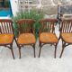 4 bentwood bistro chairs with a pattern on the seat