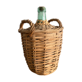 Demijohn surrounded by wicker