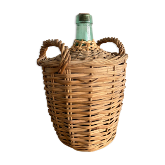 Demijohn surrounded by wicker