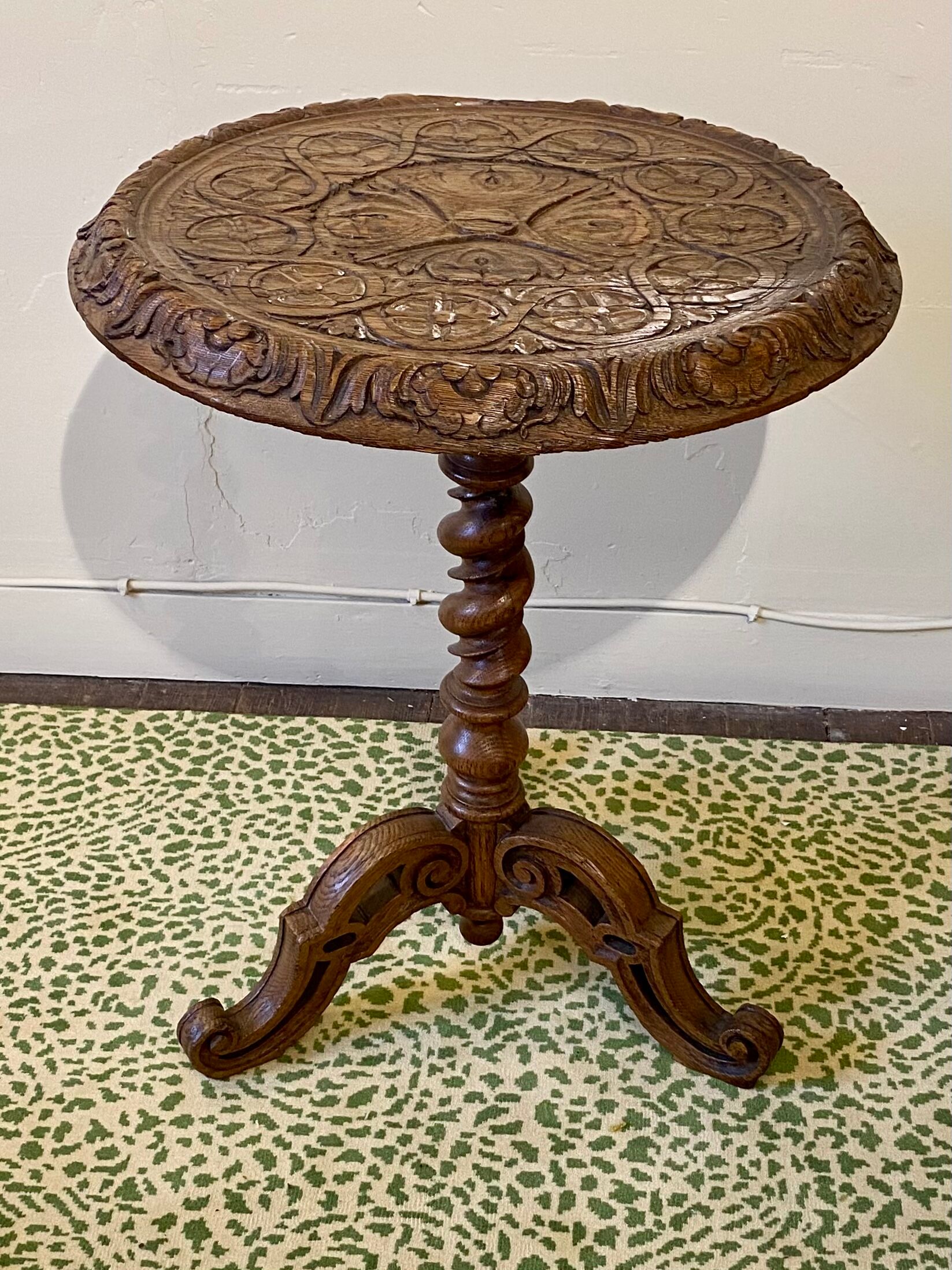 Carved wooden pedestal table