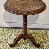 Carved wooden pedestal table