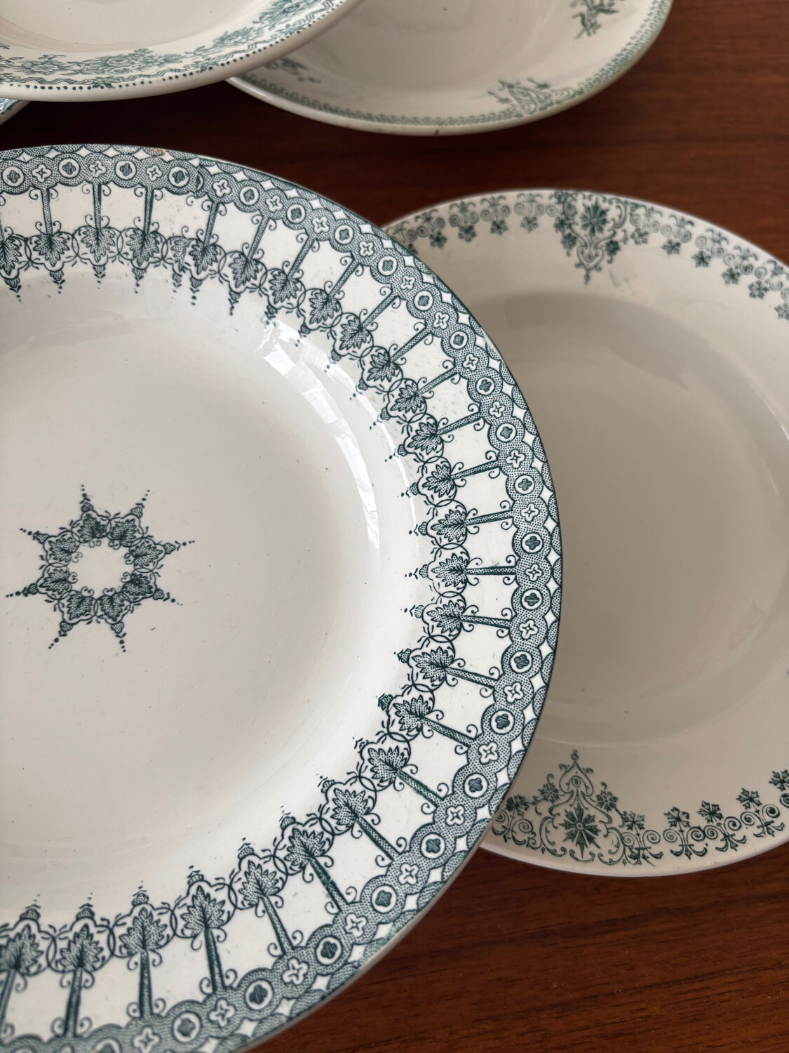 A deep plate in blue and green ironstone, antique French earthenware.