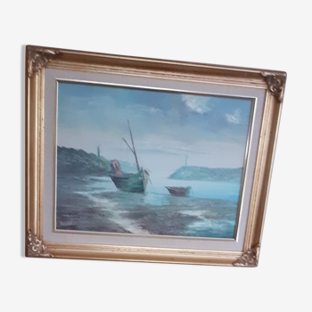 Marine painting signed oil painting, boats strandedin a harbor, in the distance is a lighthouse