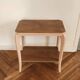 Side table with curved pink legs
