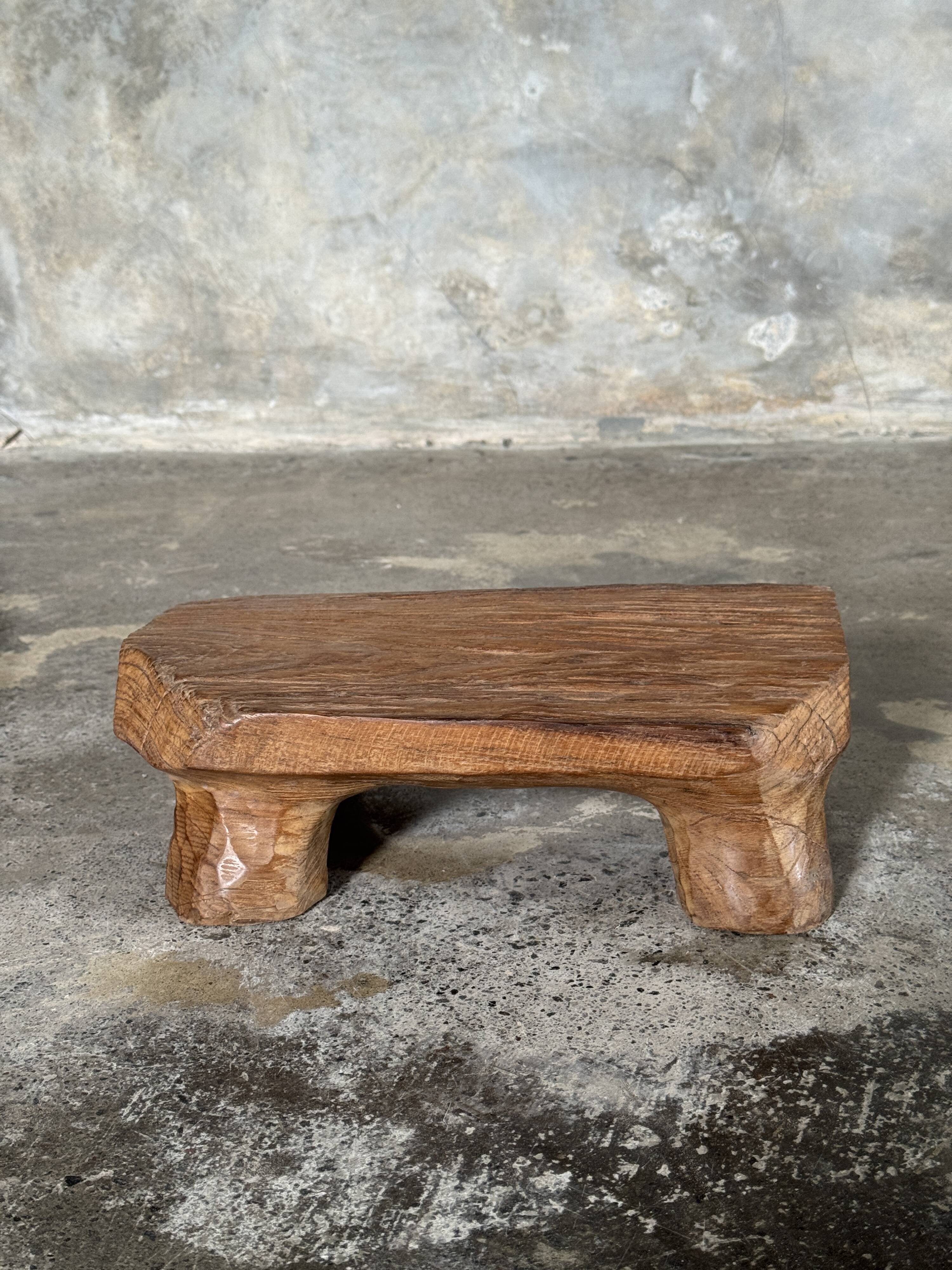 Small stool, teak footrest with short cut corners.