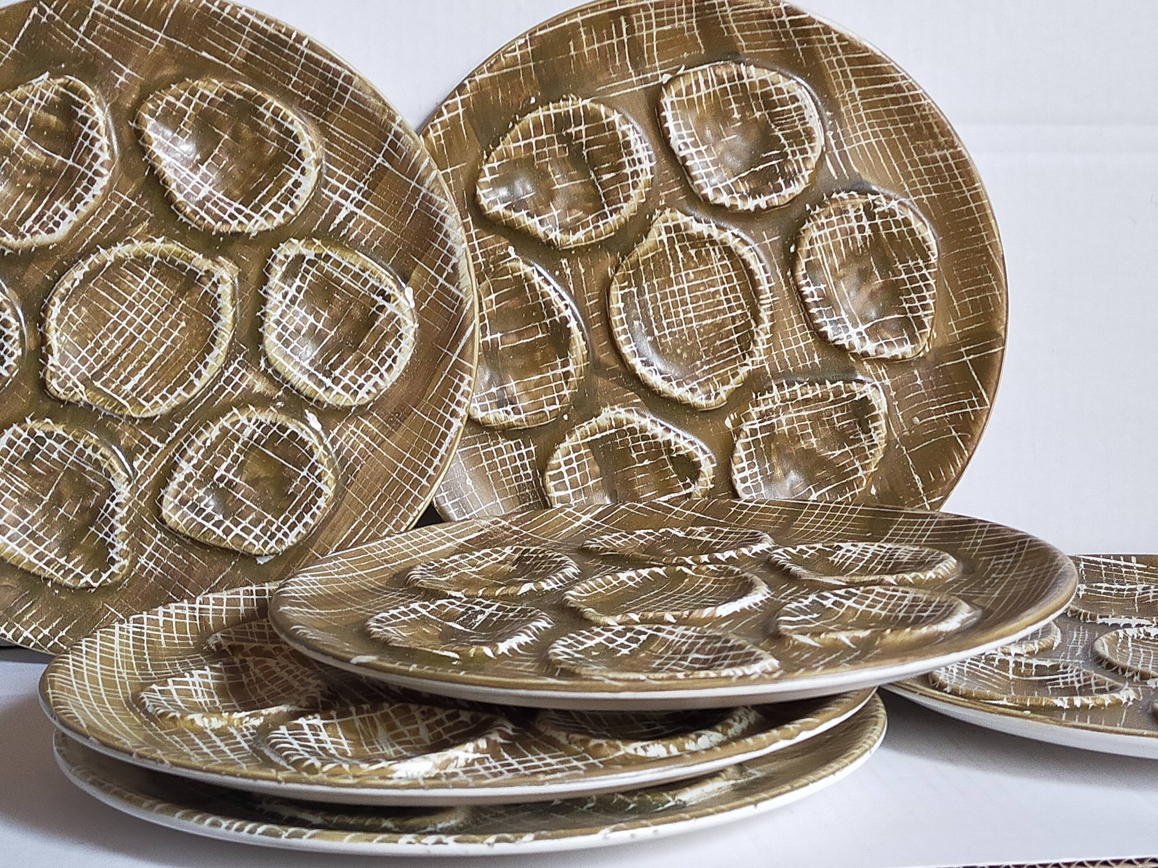 Six oyster plates earthenware with matte enamel, 50s