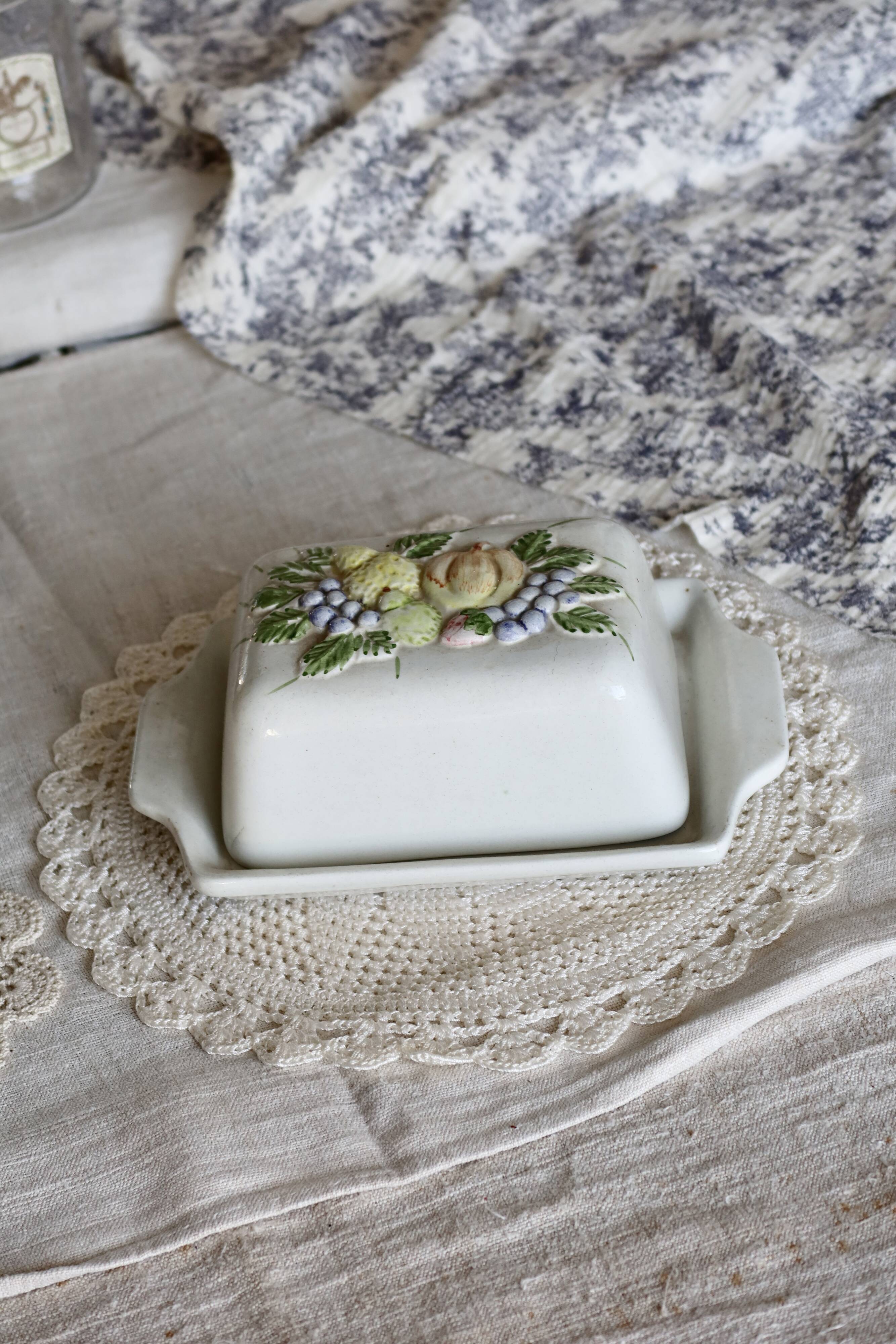 Large vintage earthenware and slip butter dish with fruit motif