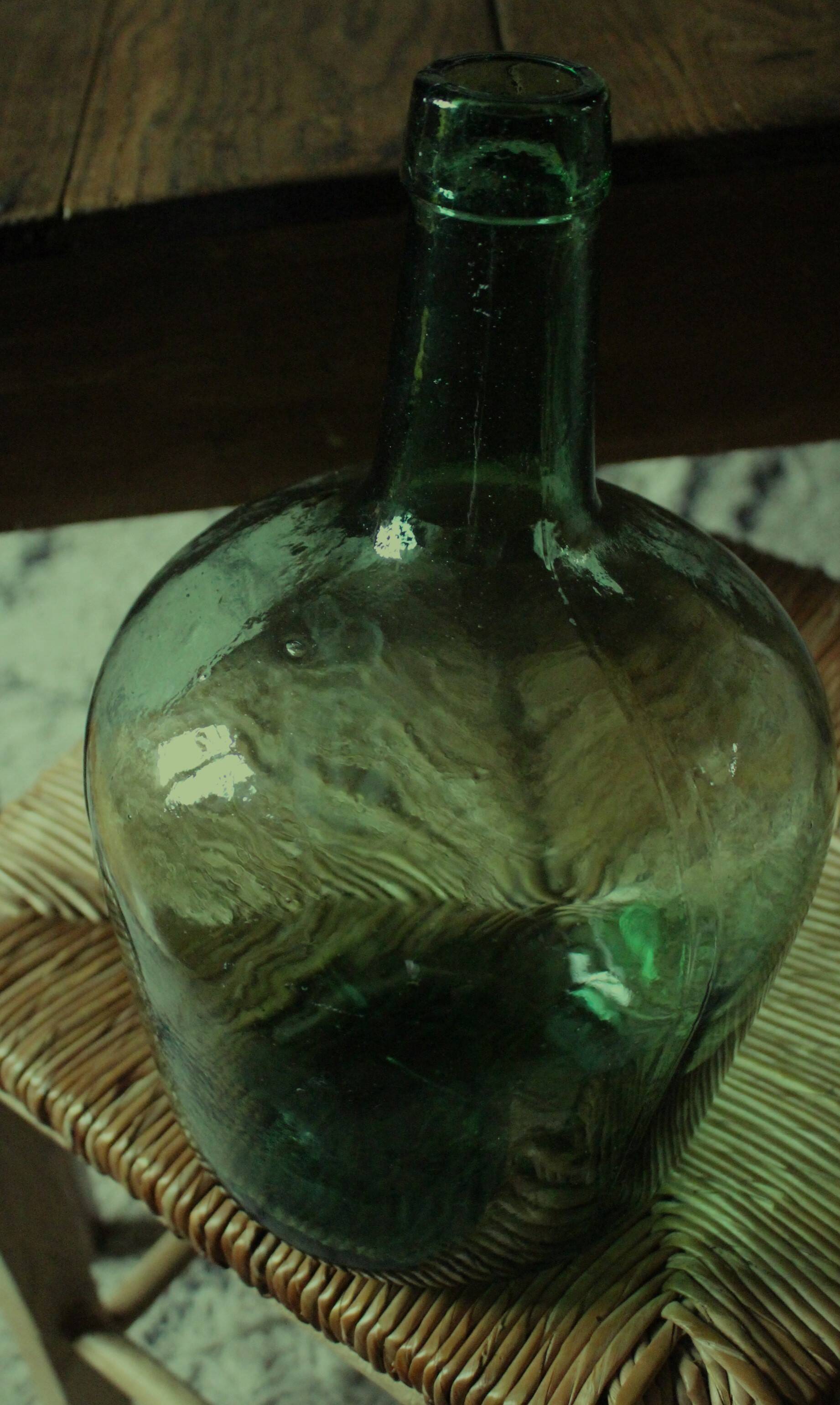 Dame Jeanne carboy from the Viresa Collection in green glass