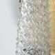 Vintage glass wall sconce from the 1960s in brass, mid-century light.
