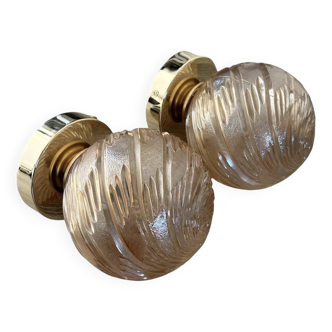 Pair of golden globe wall lights