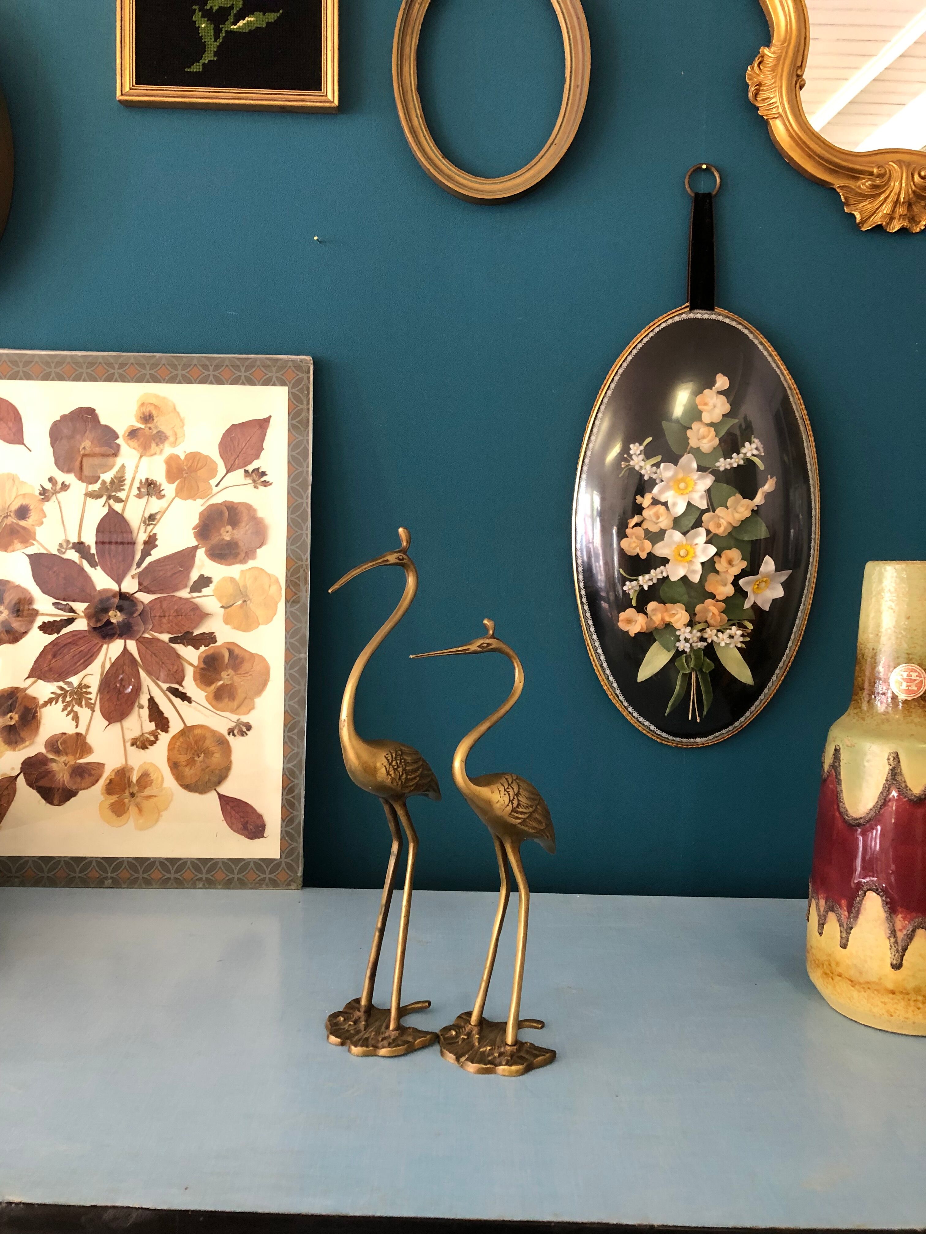 Couple of brass herons