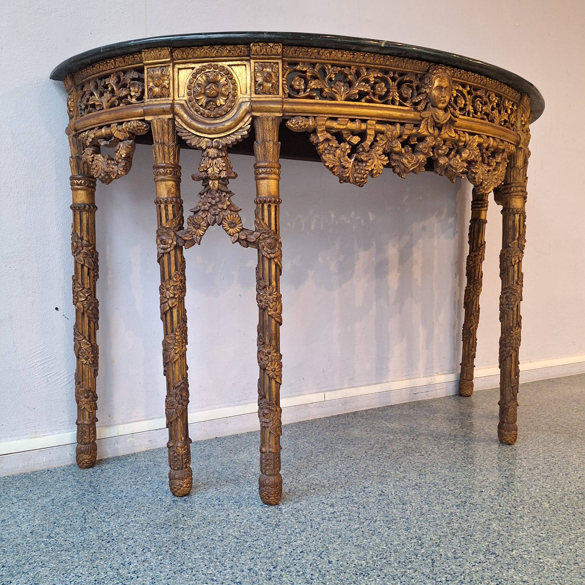 French baroque half-moon wall console with marble and six legs.