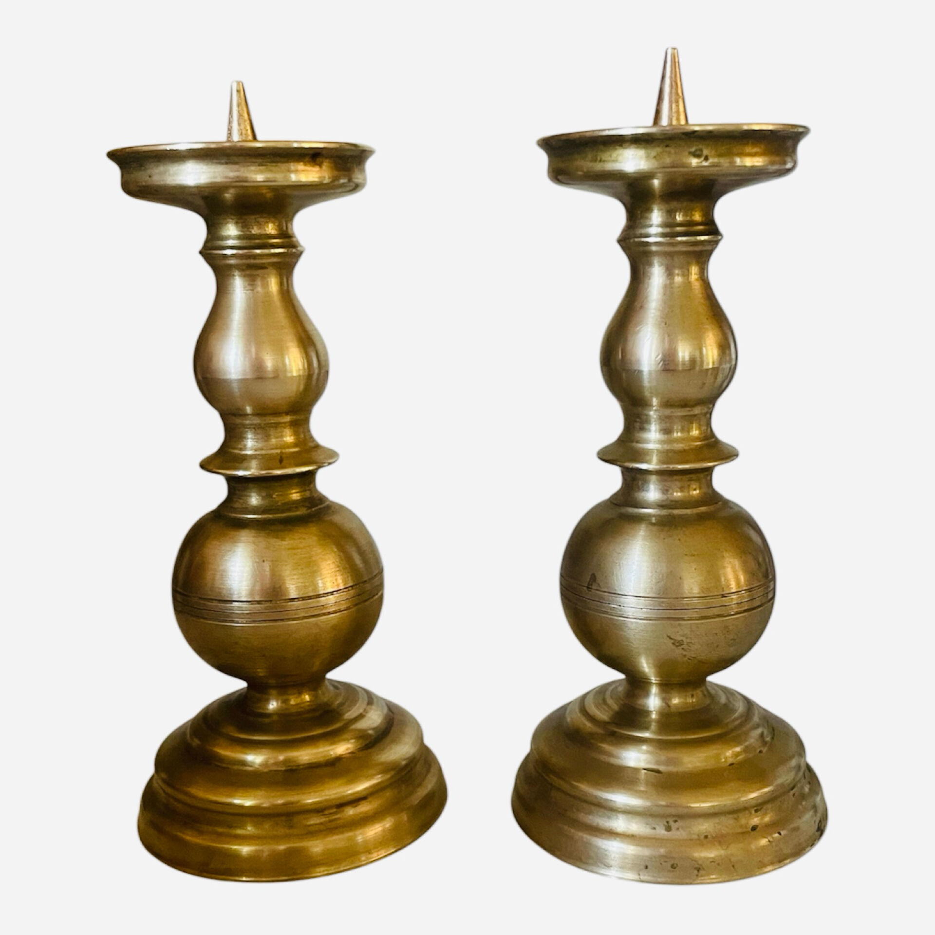 Pair of solid brass candlesticks from the 19th century.