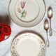 Old mismatched earthenware dessert plates with gold accompanied by a dish