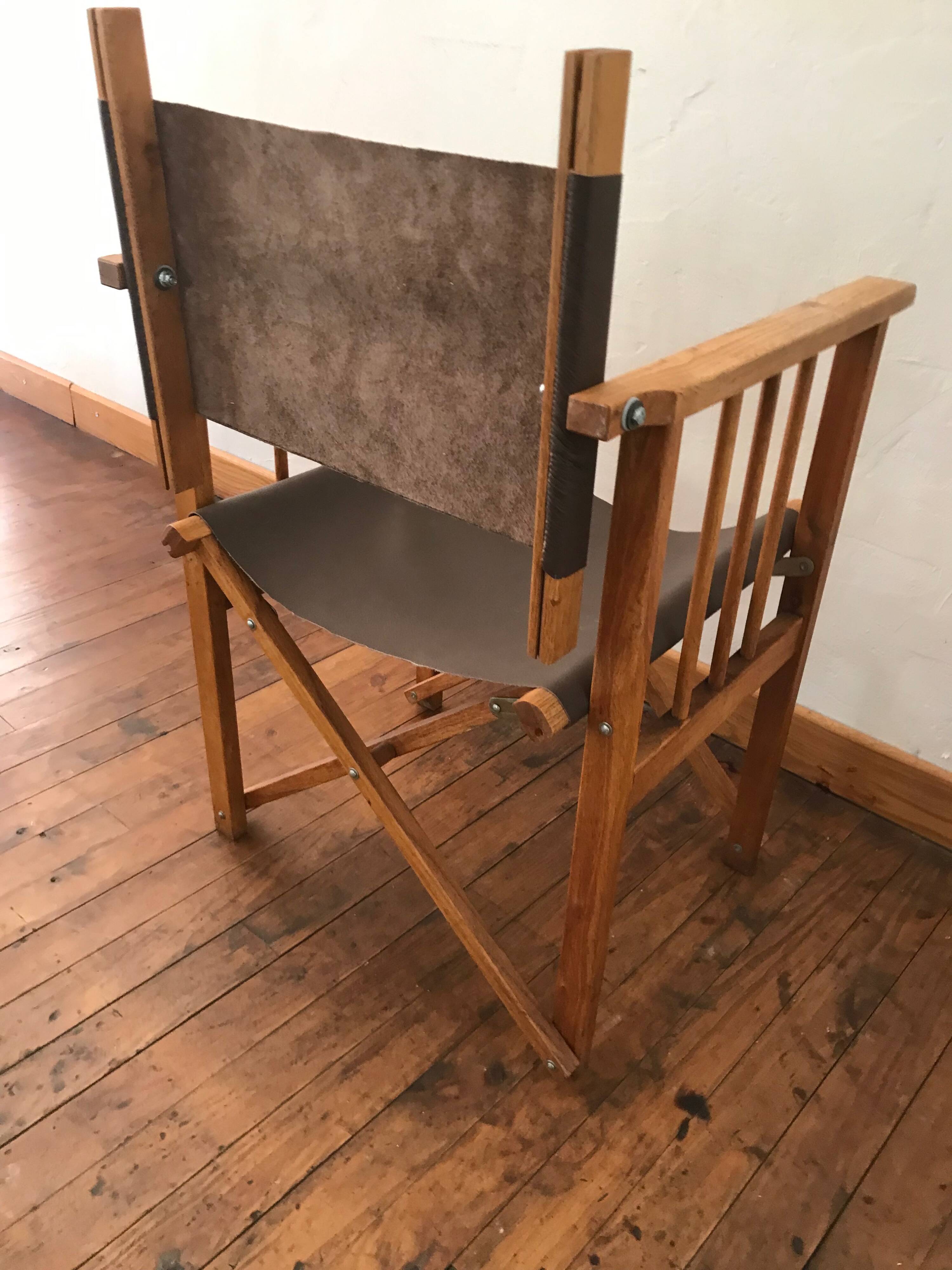 pair of Safari armchairs in wood and leather
