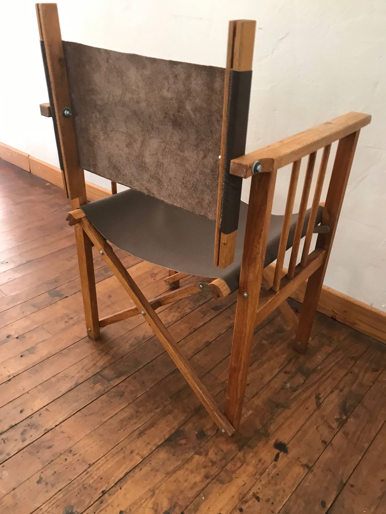 pair of Safari armchairs in wood and leather